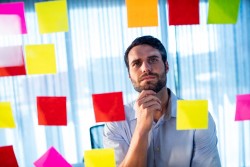 Man focusing on notes